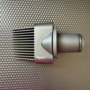 Dyson supersonic wide-tooth comb hair dryer attachment.